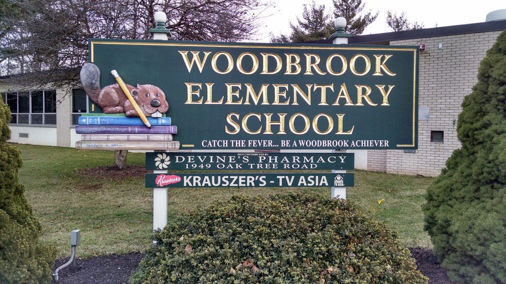 Sign for Woodbrook Elementary in Edison, With a Woodchuck
