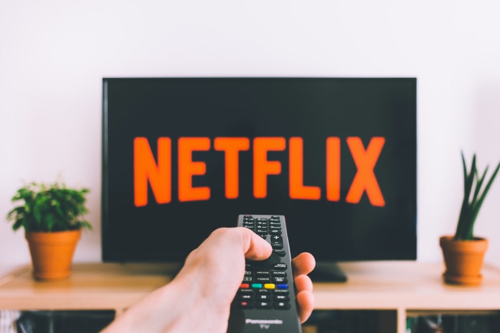 Pointing Remote at TV, Which says Netflix