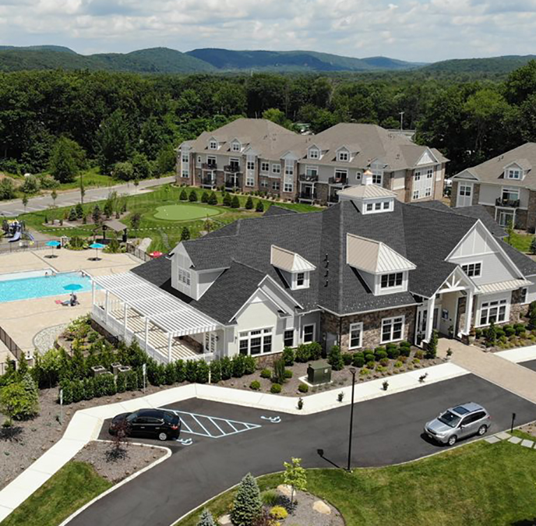 Overlooking Pondview Estates buildings, parking lot, recreational centers and pool