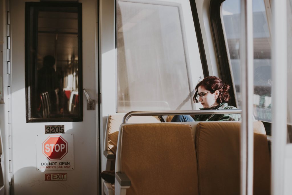 woman commuting on train
