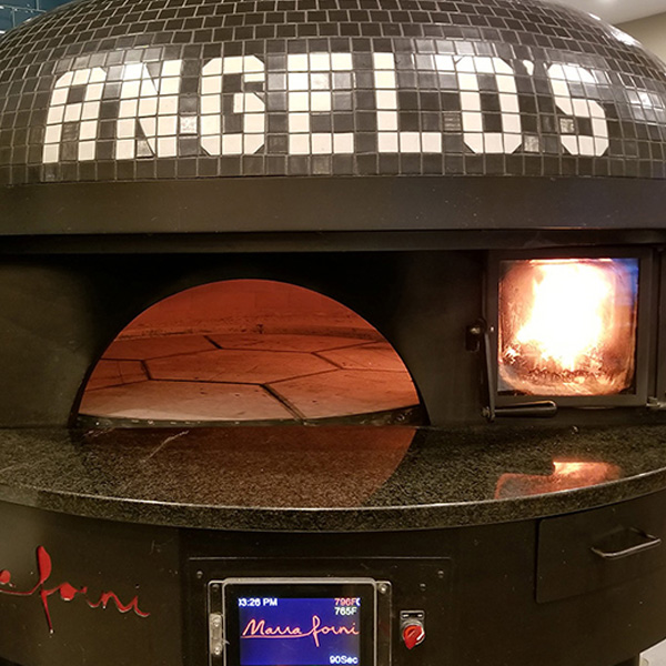 Wood fire pizza oven at Angelo's Italian eatery.