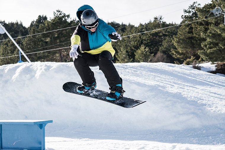 Snowboarder airborn.