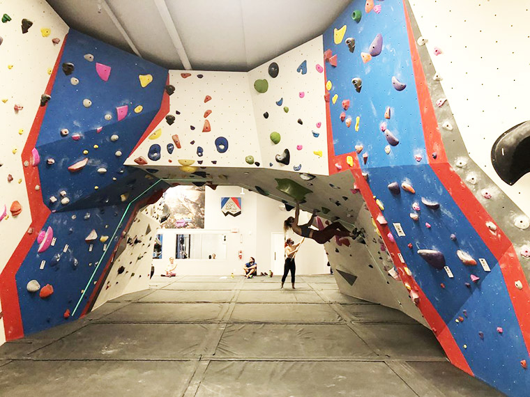 Person climbing wall at The Gravity Vault in Montclair, NJ.