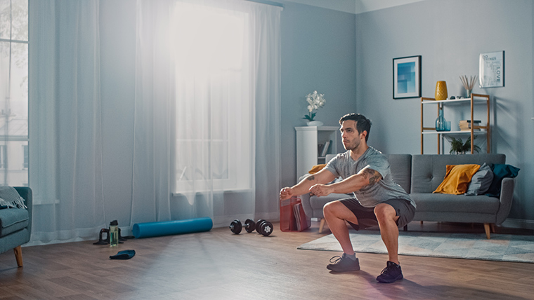 man doing exercise in apartment