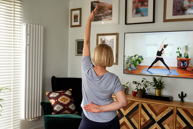 woman exercising alone in apartment