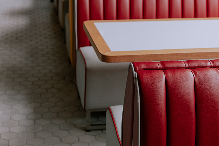 Close up view of 1950s era diner booth and table