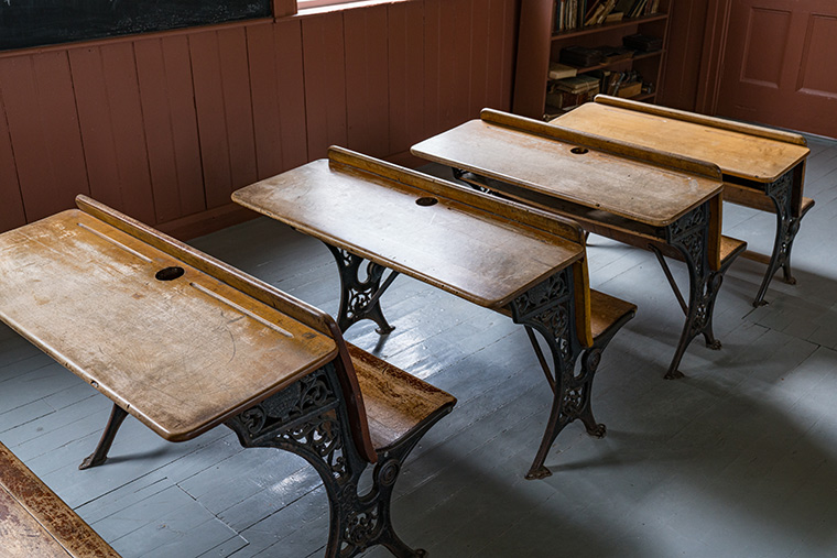 Close up view of antique school desks