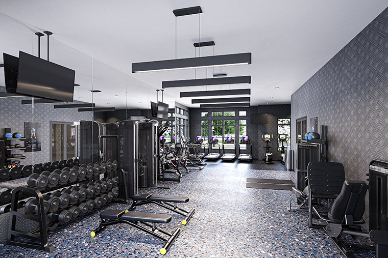 On-site fitness center at the Legacy Place Apartments showing a variety of fitness equipment from free weights, machines, and treadmills.